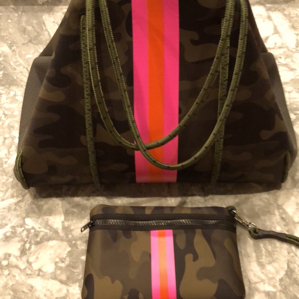 Neoprene bag with Wristlet. Some signs of use with plenty of life left!